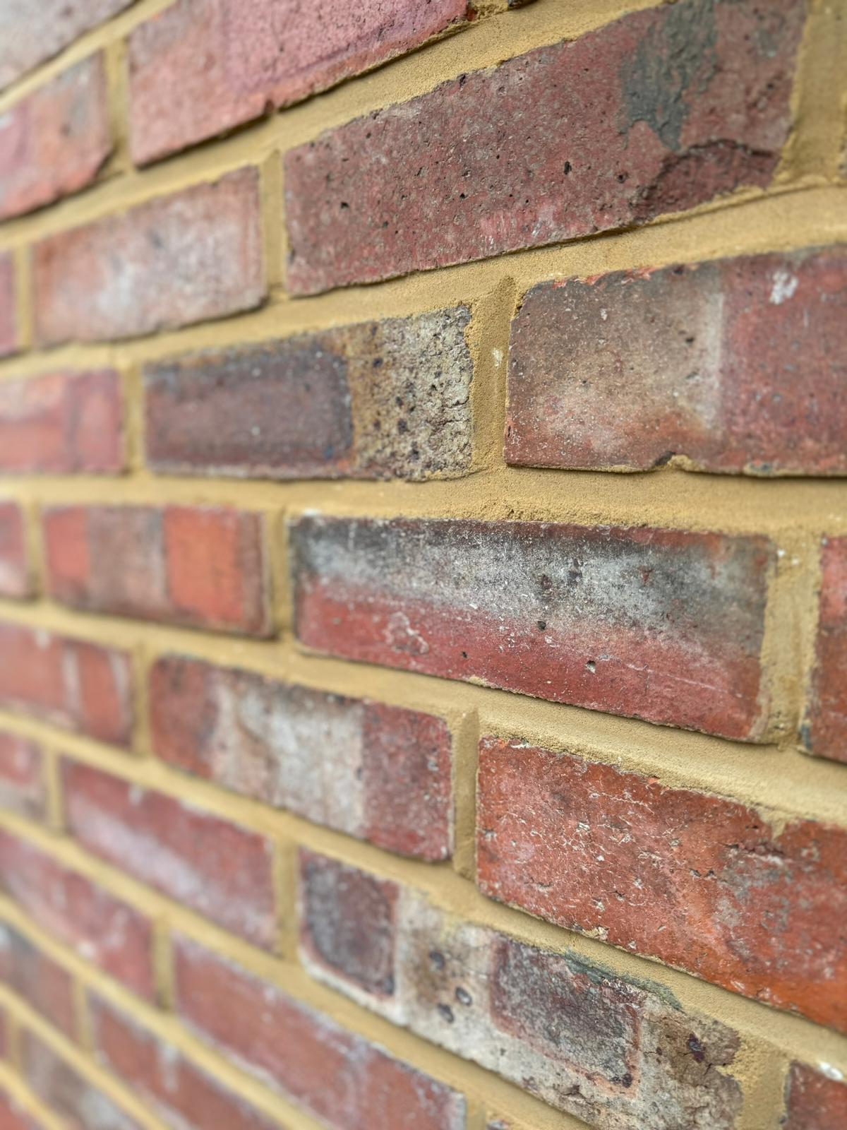 Close-up of fresh repointing with buff mortar