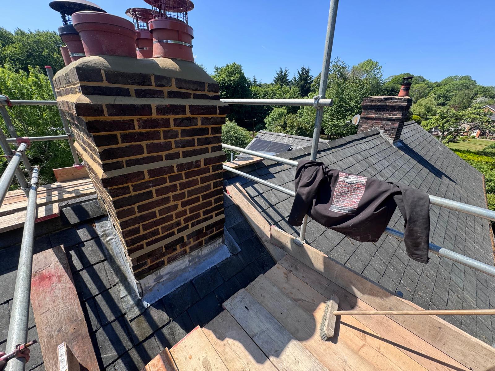 Chimney repointing in progress on scaffolding